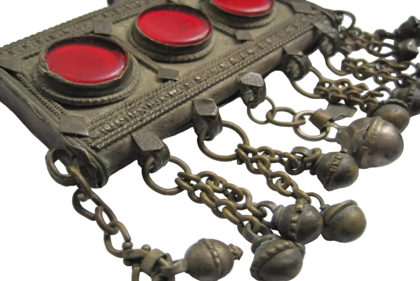 Close up of Bedouin pendant hanging chains on a white background