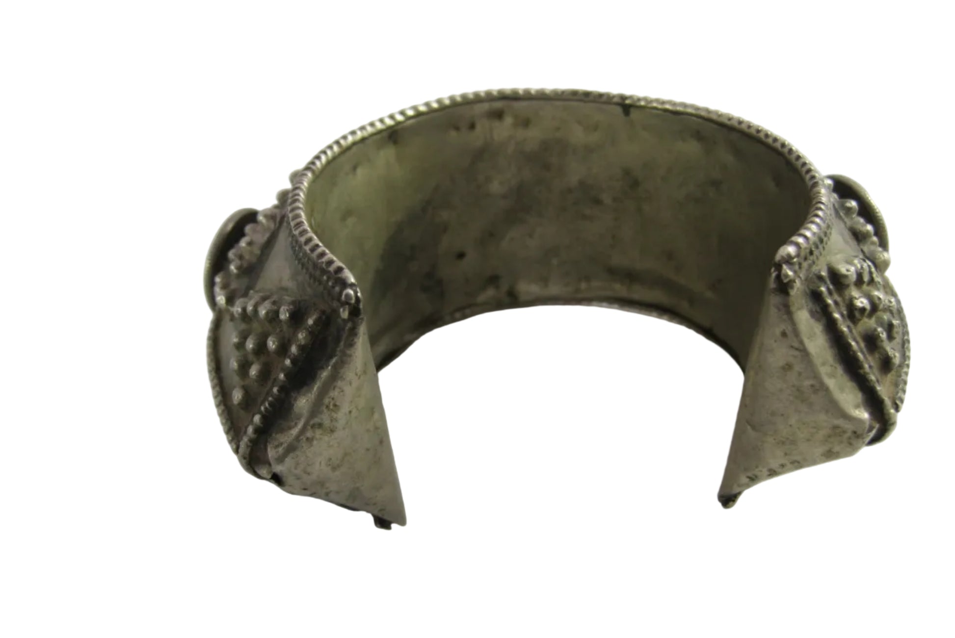 Decorative silver bracelet on a white background