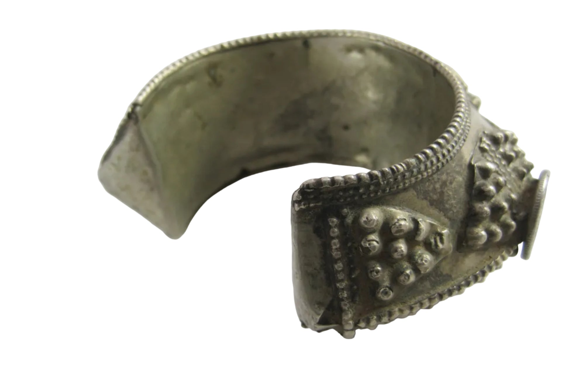 Decorative silver bracelet on a white background