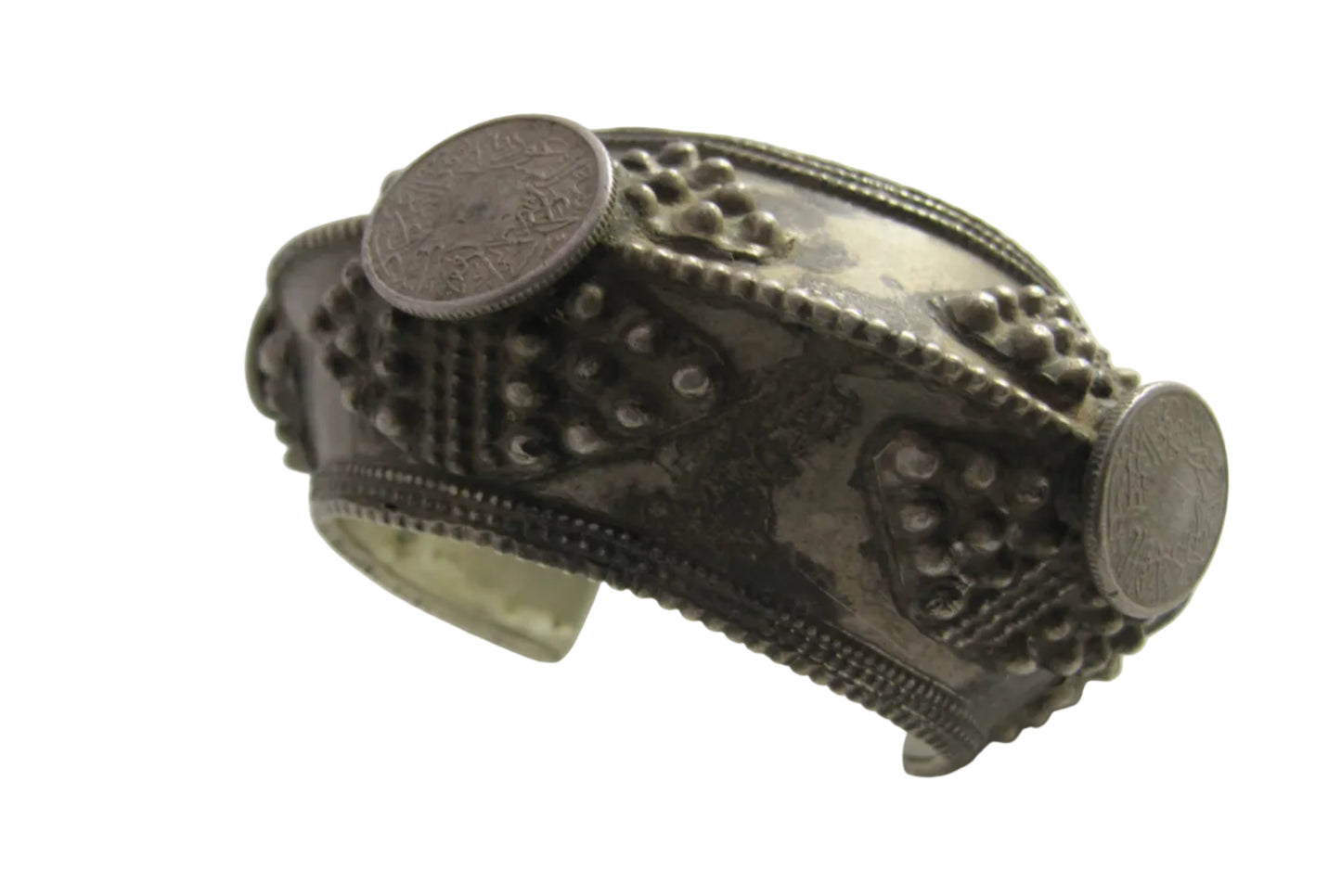 Decorative silver bracelet with coin elements on a white background