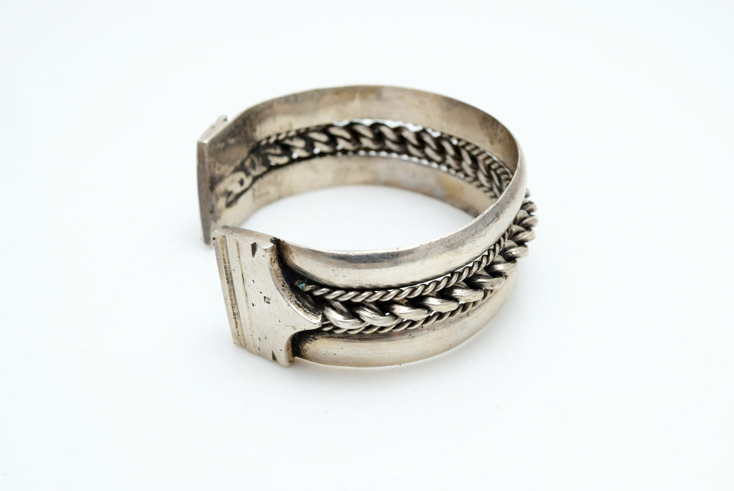 Silver Egyptian bracelet with intricate design on a white background