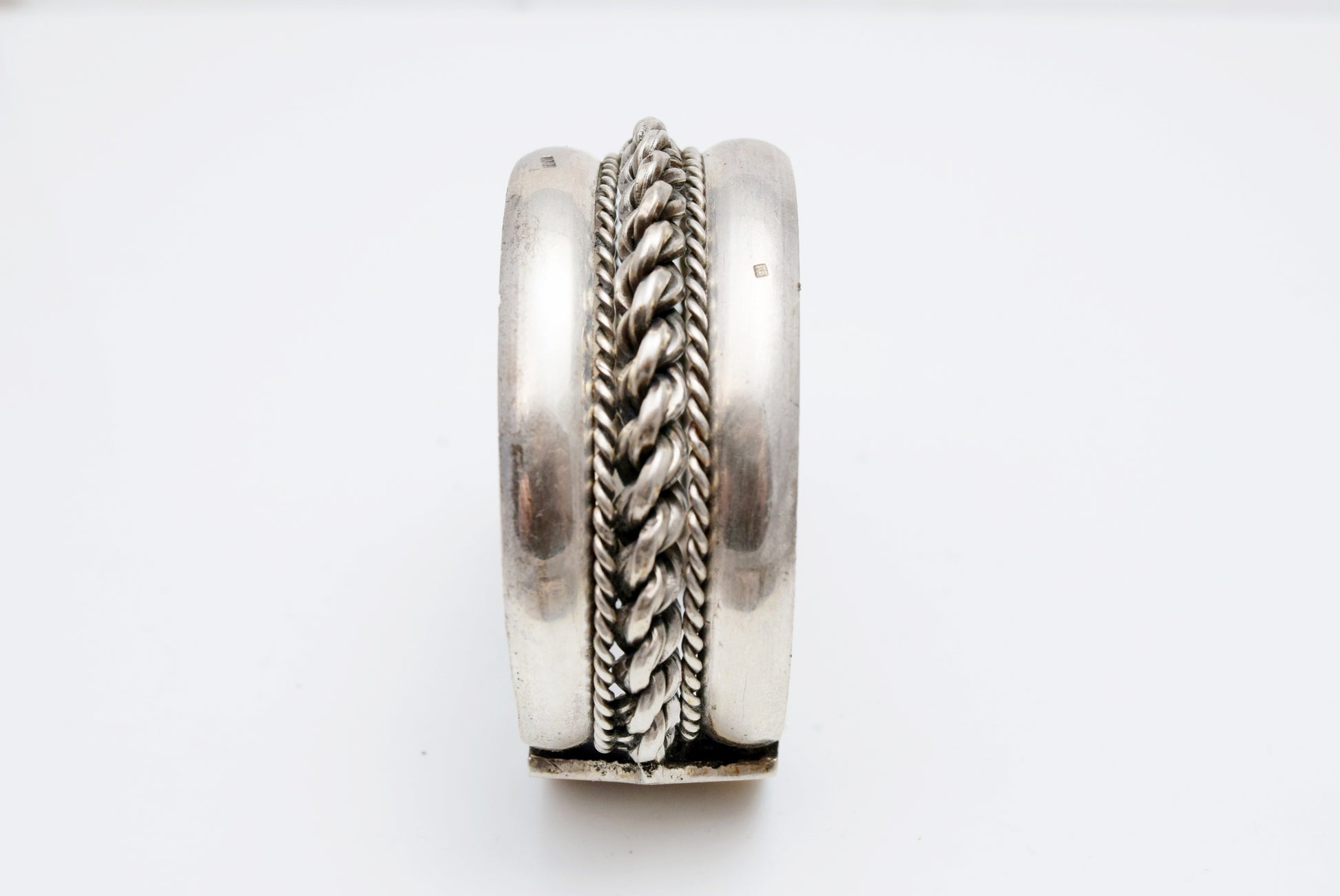 Silver Sinai bracelet with twisted braid design on a white background