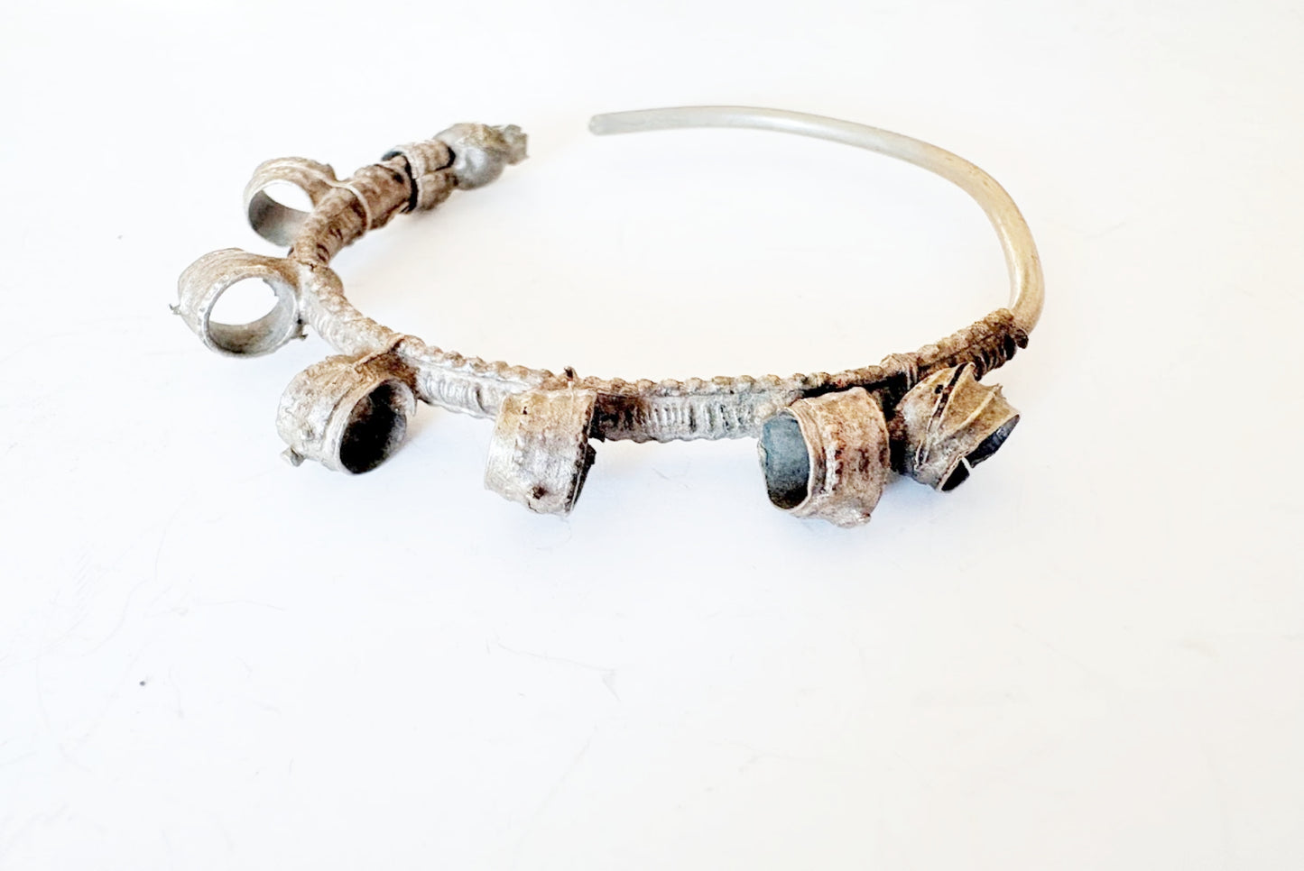 Hoop earring with six loops on a white background