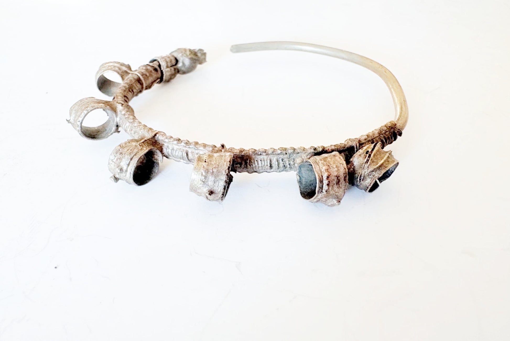 Hoop earring with six loops on a white background