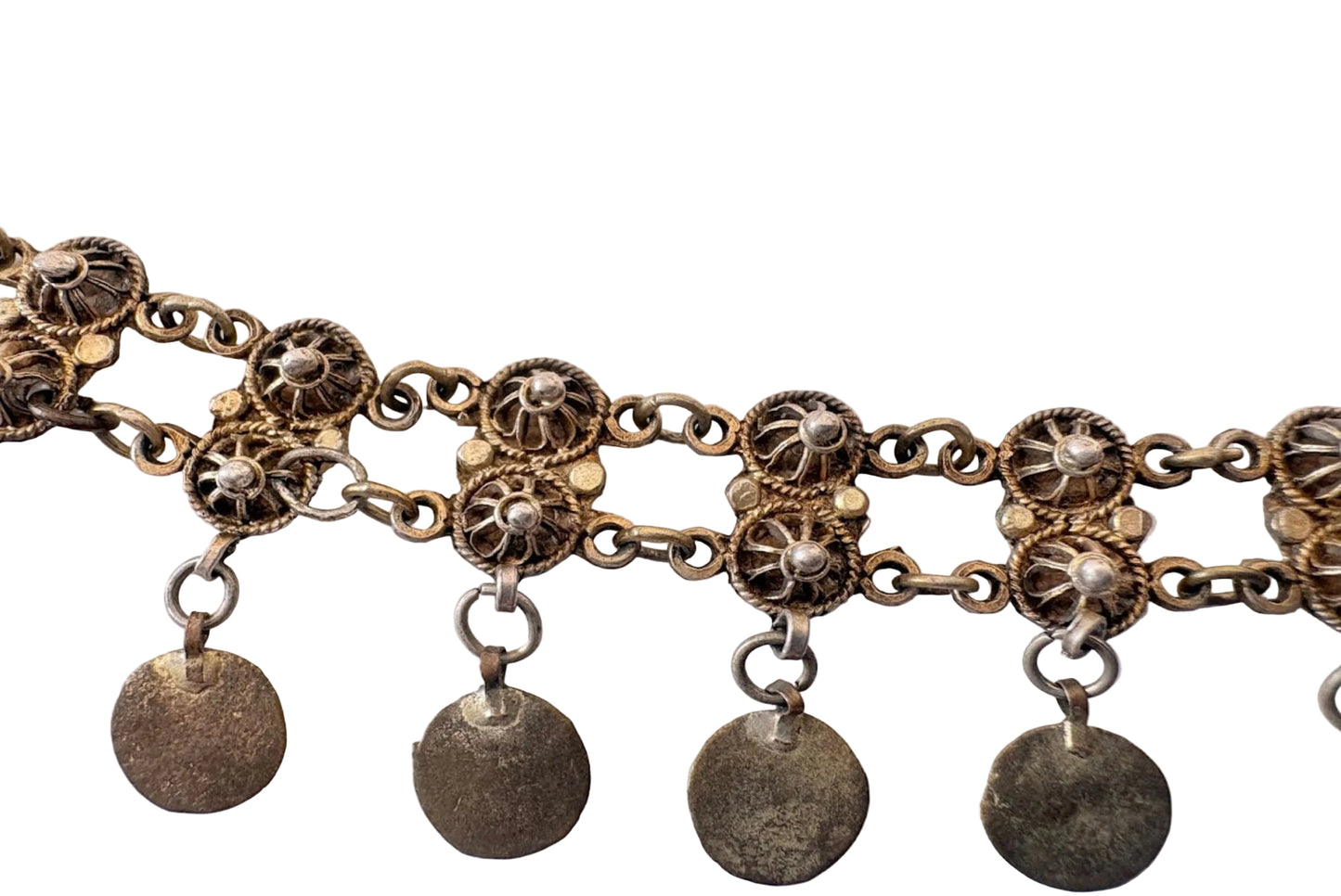 Close up of filigree Greek headband on a white background