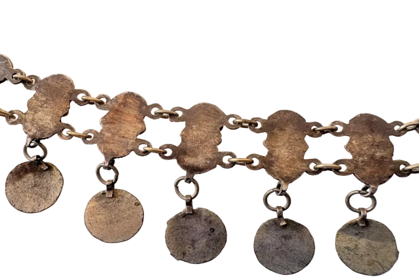 Close-up of a chain with round pendants on a white background