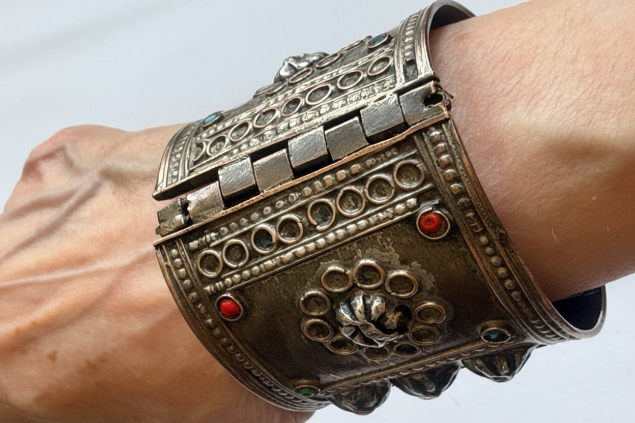 Syrian bracelet worn on a white background
