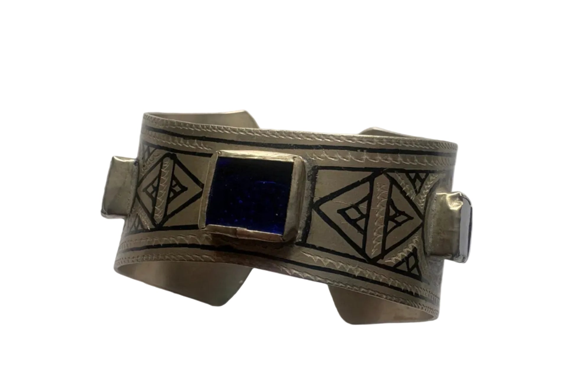 Silver bracelet with geometric designs and a blue stone on a white background