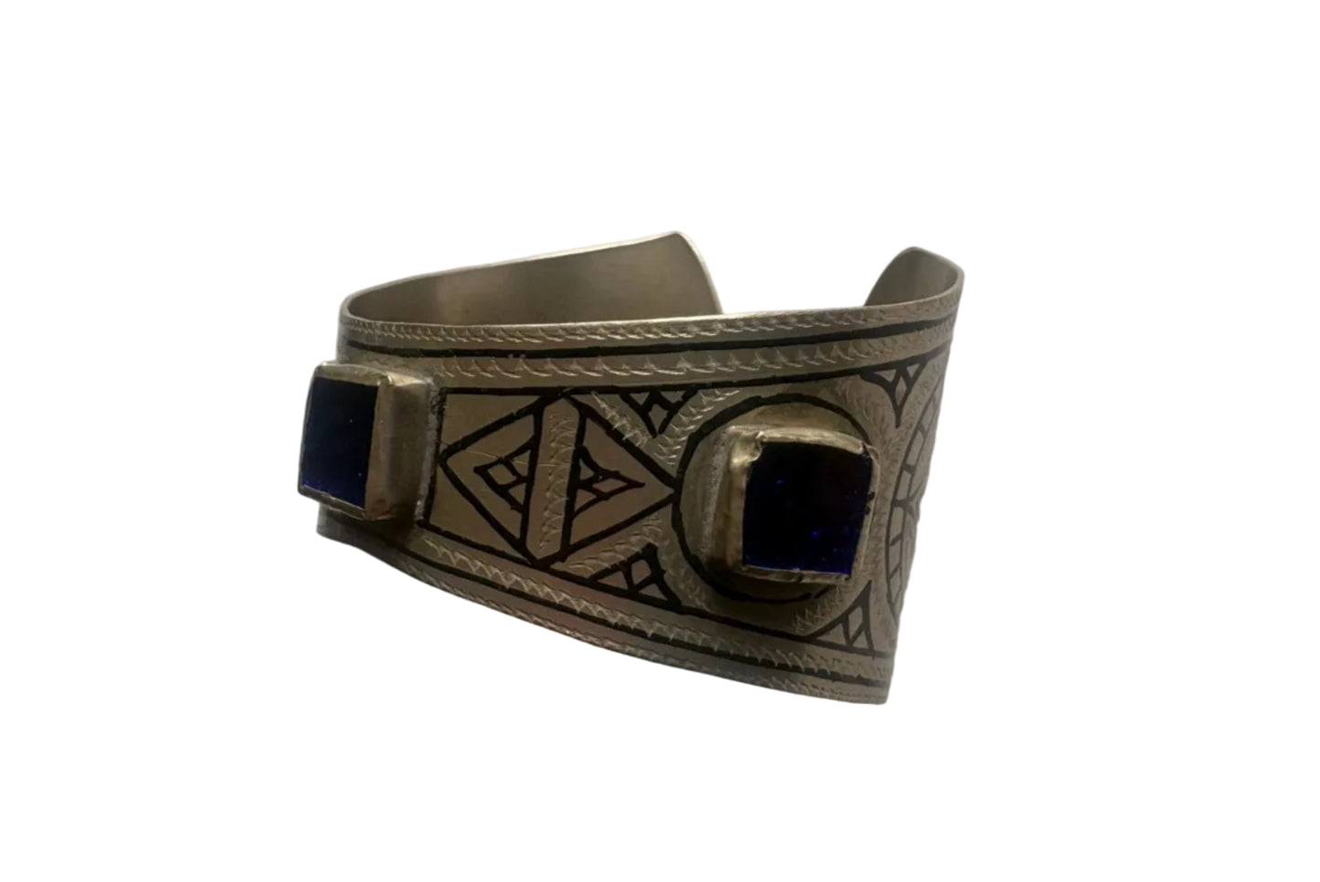 Flared Moroccan bracelet with geometric design and blue stones on a white background