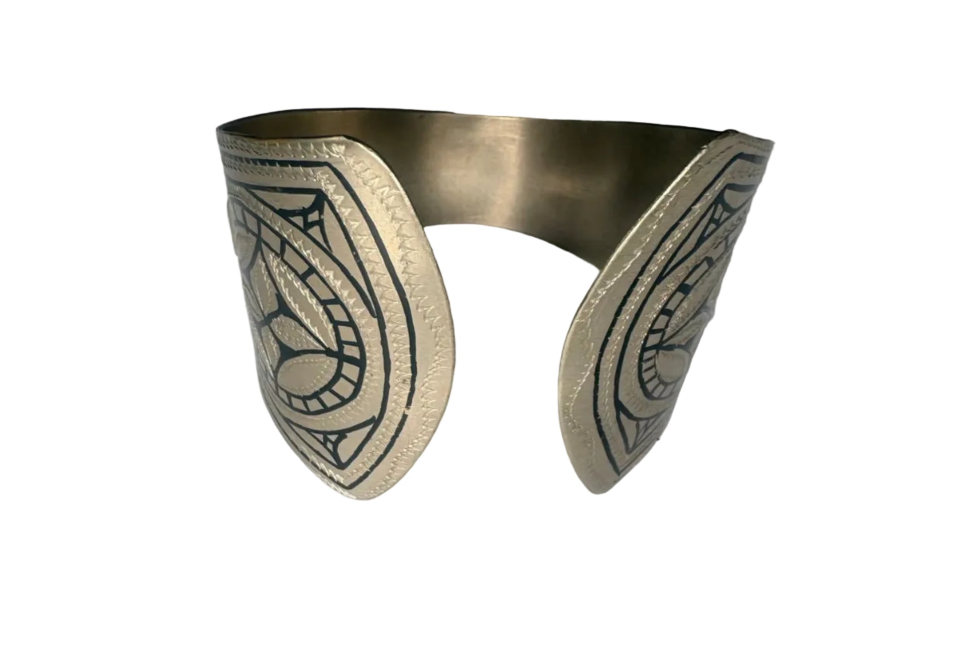 Moroccan bracelet with intricate designs on a plain background
