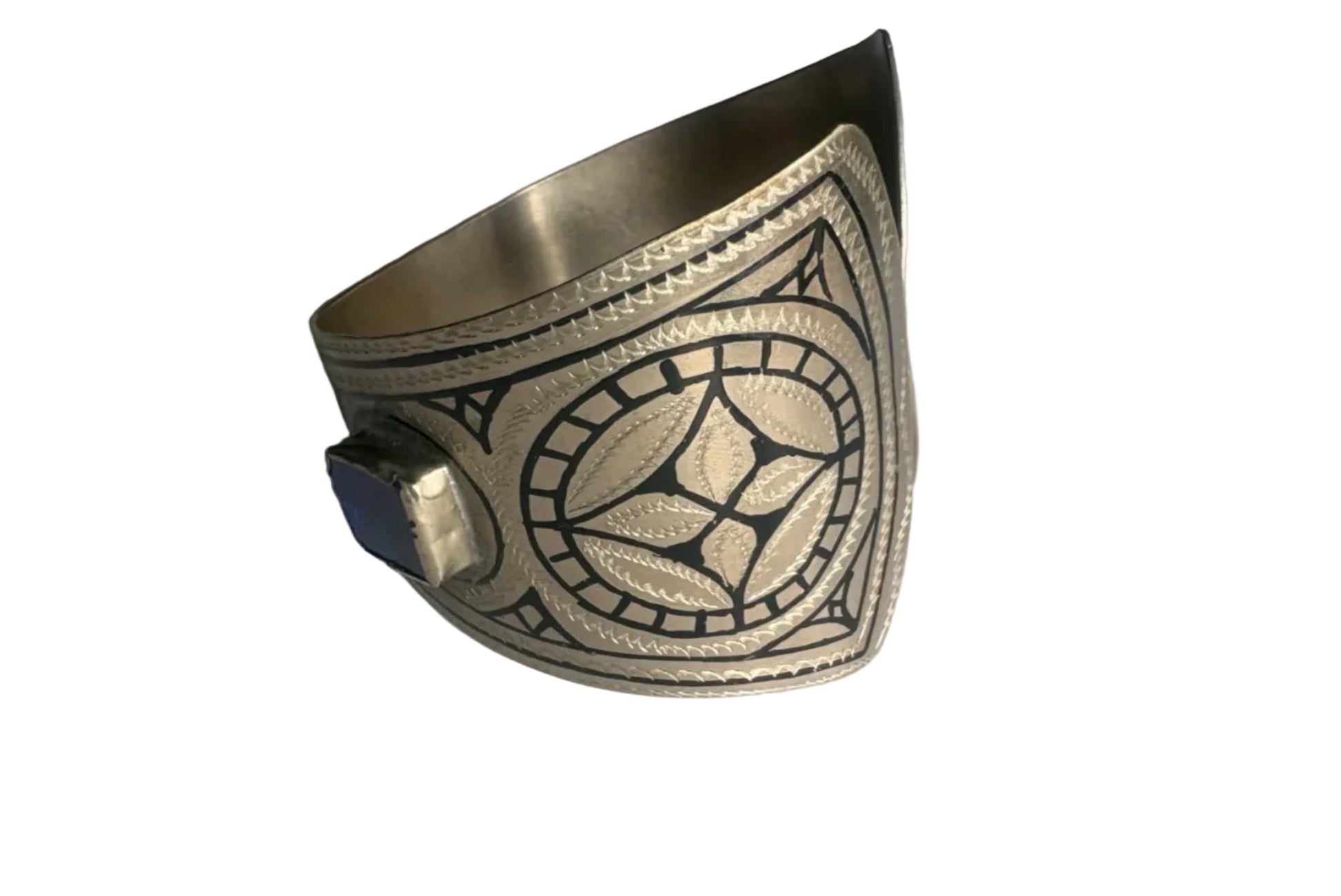 Decorative silver cuff bracelet on a white background