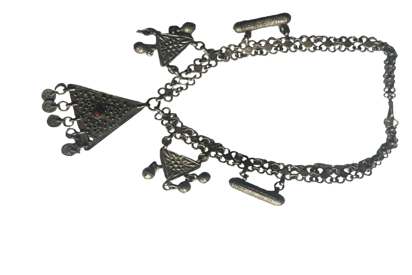 Silver necklace with charms on a white background