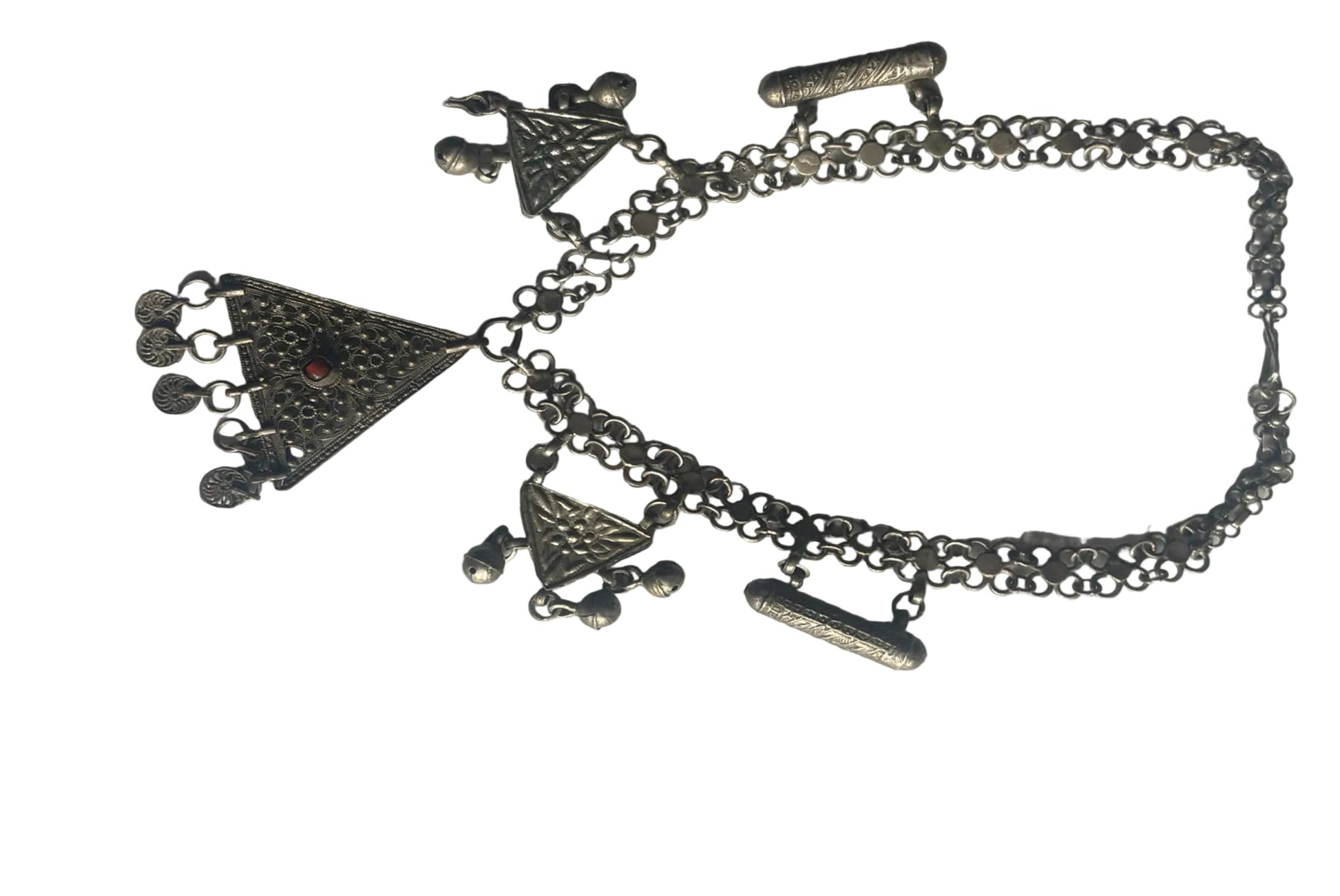 Silver necklace with charms on a white background
