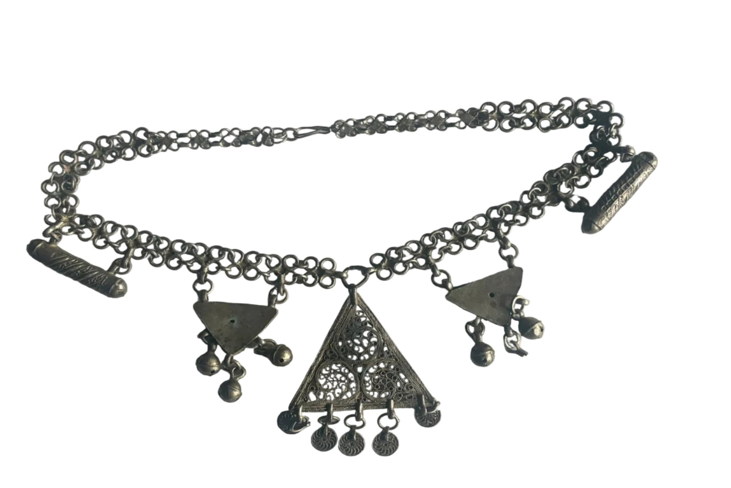 Silver chain with geometric pendants on a light gray background