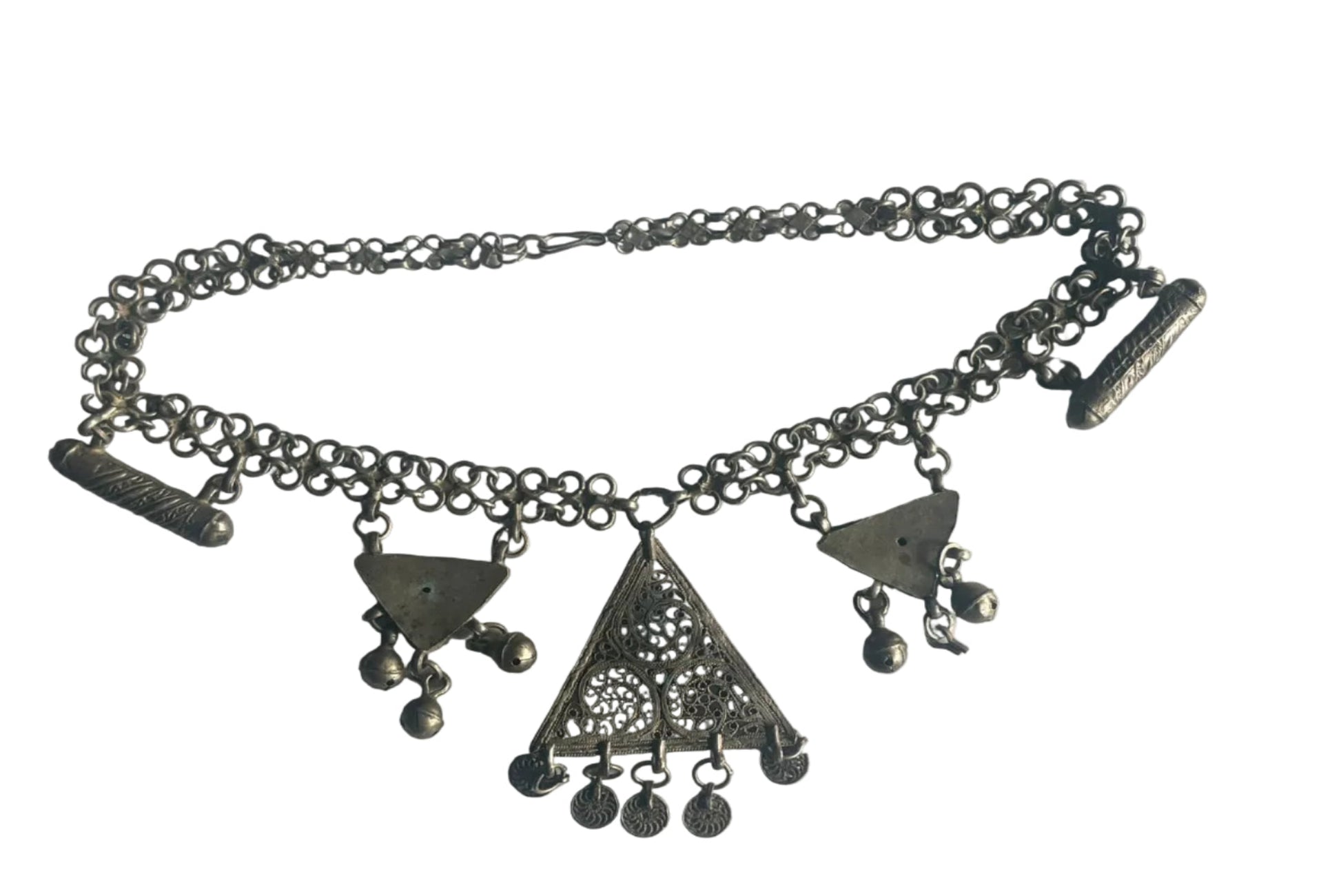 Silver chain with geometric pendants on a light gray background