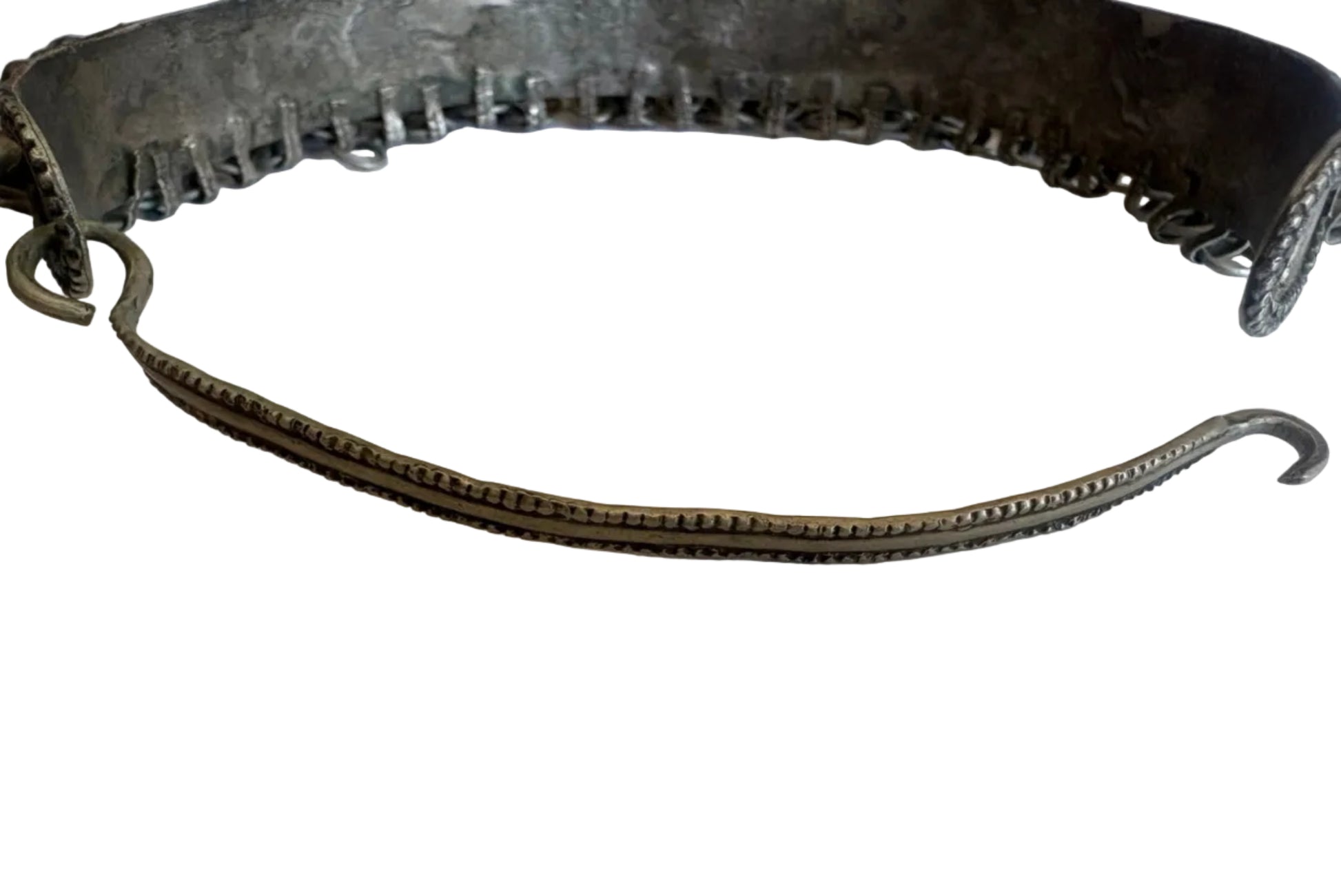 Metallic torc necklace back view on a white background