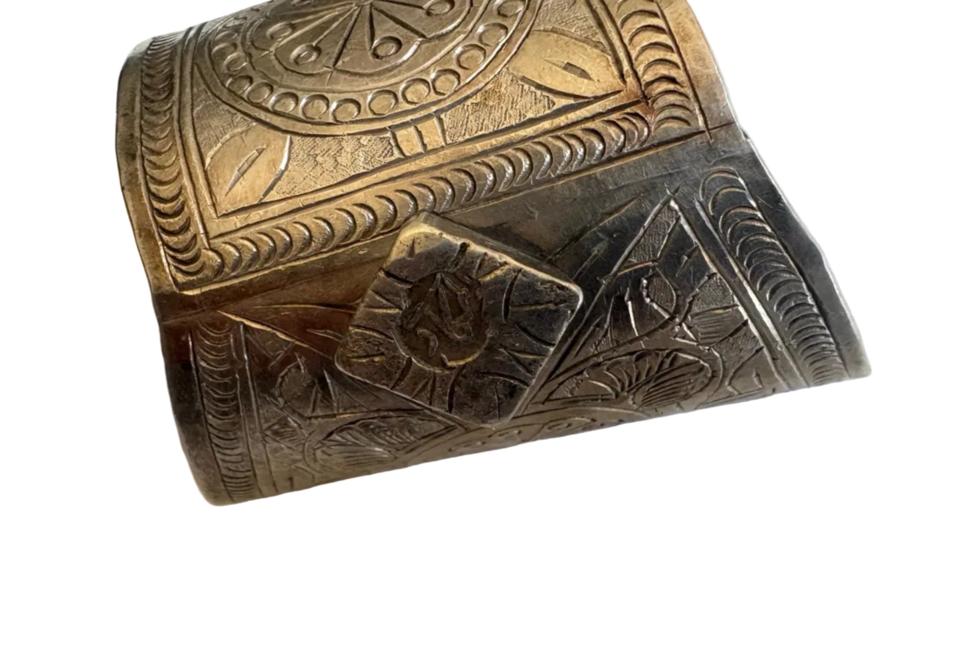 Decorative Egyptian silver bracelet with intricate patterns on a white background