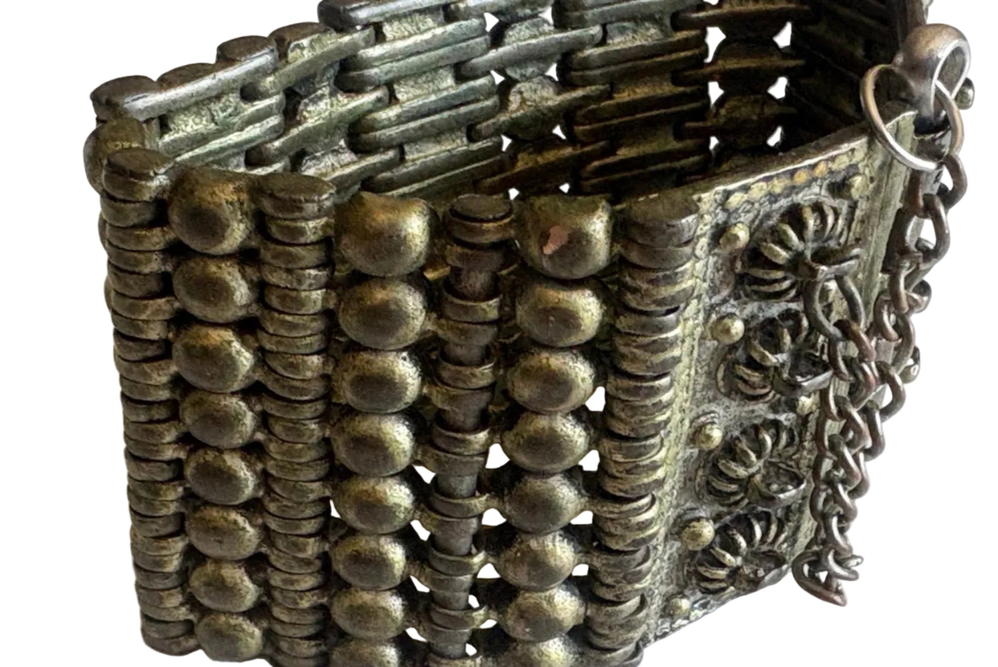 Decorative bracelet with intricate patterns on a white background