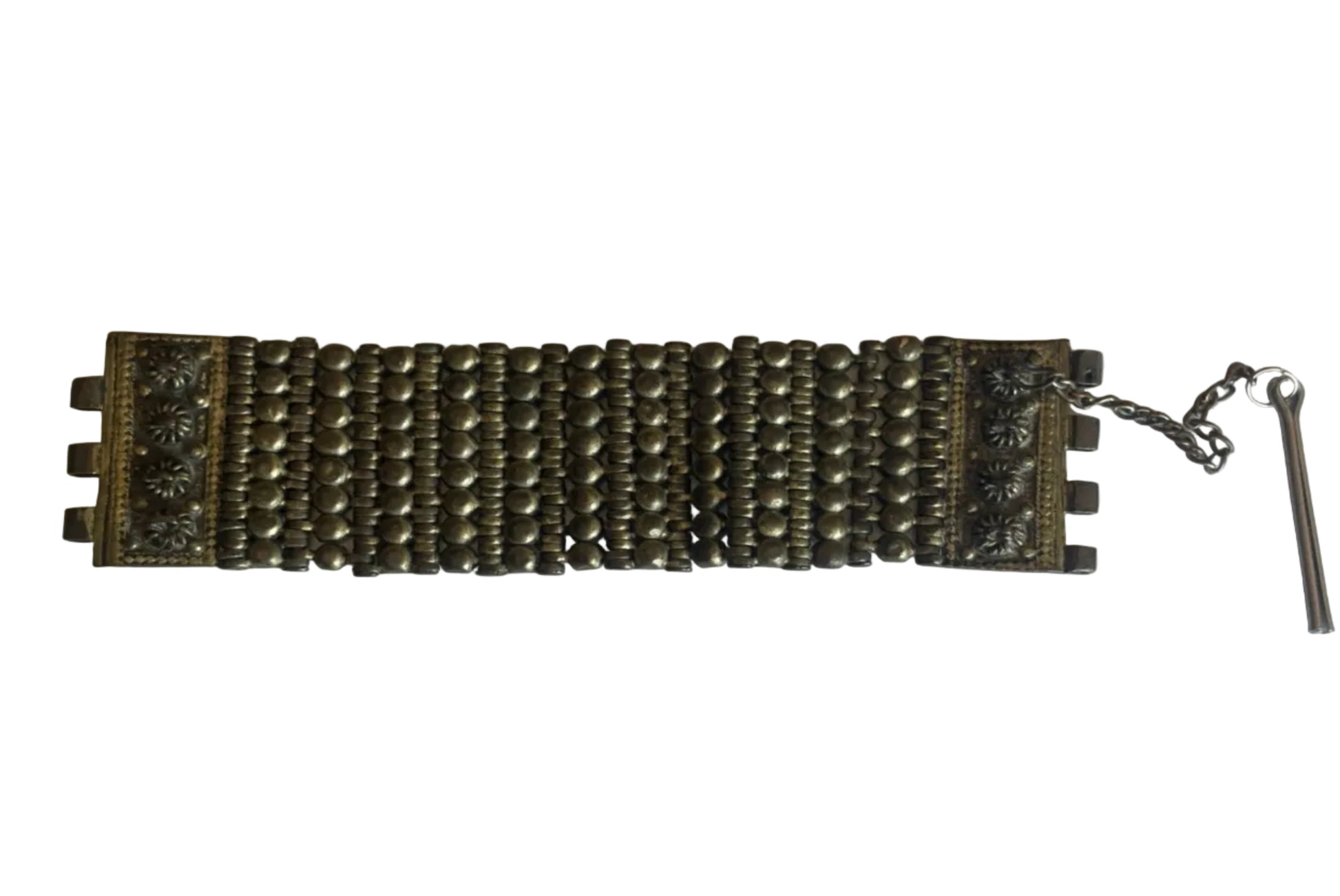 Decorative metal bracelet on a white background