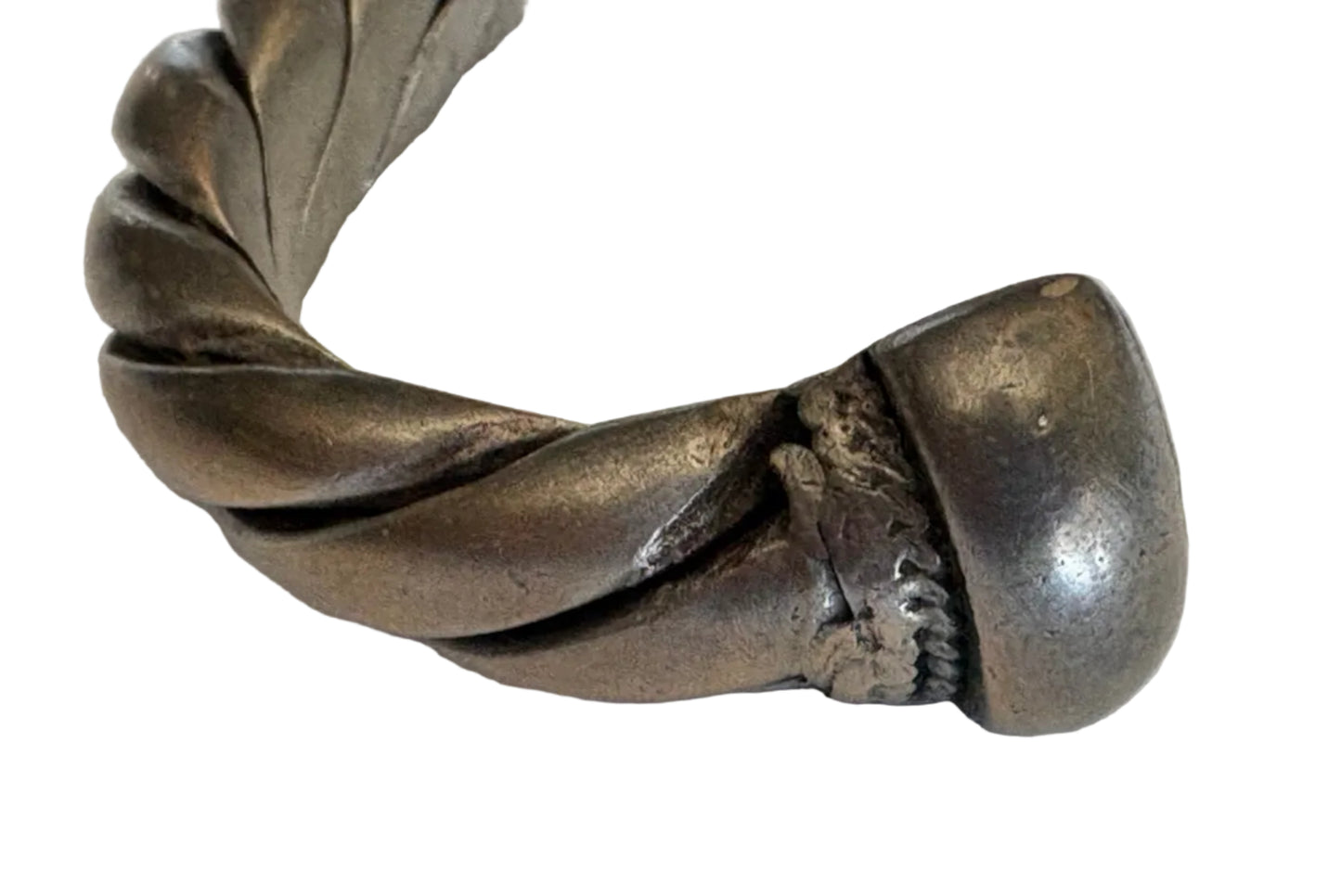 Silver twisted Saudi bracelet on a light background