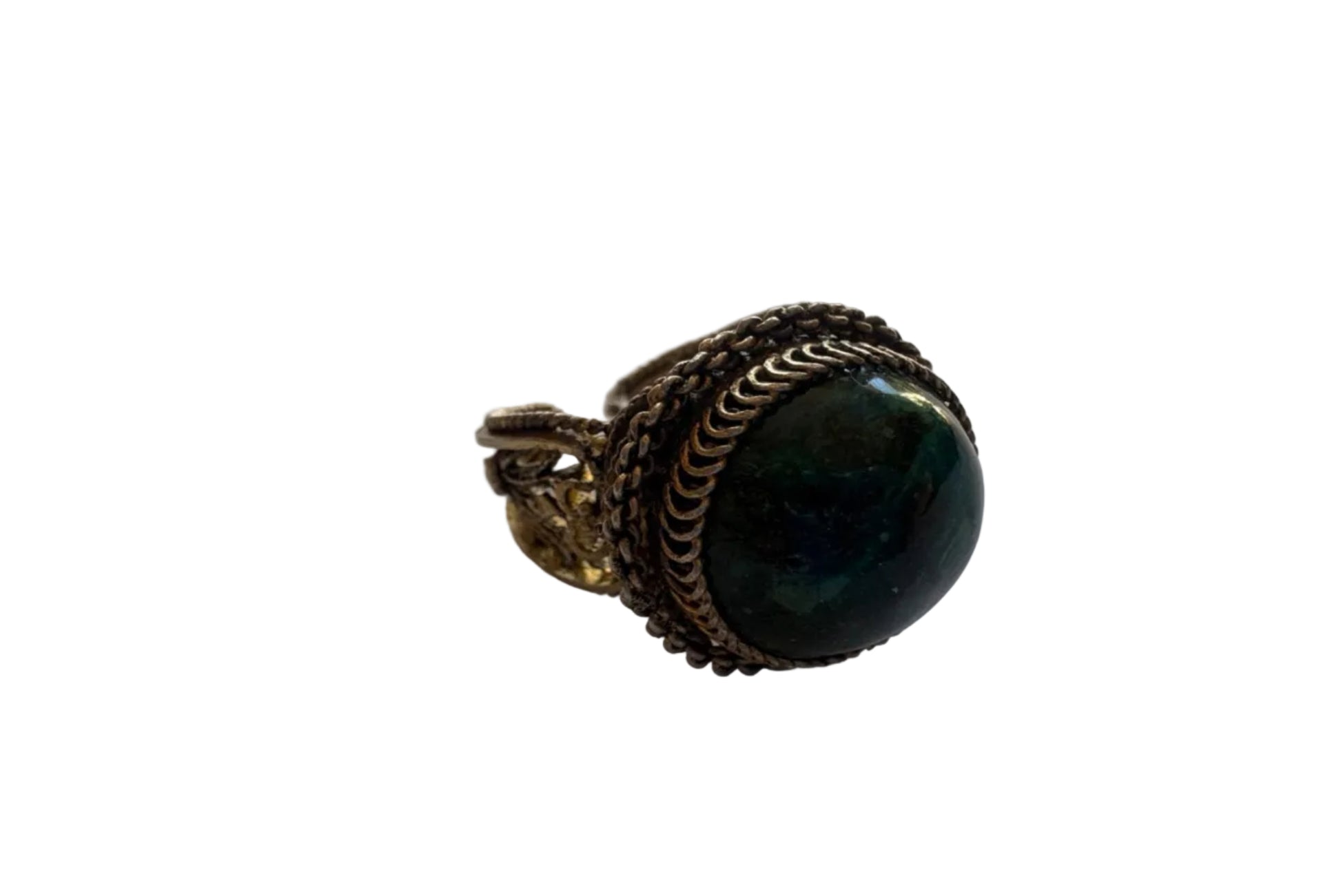 Ring with a dark green gemstone and gold band on a light gray background