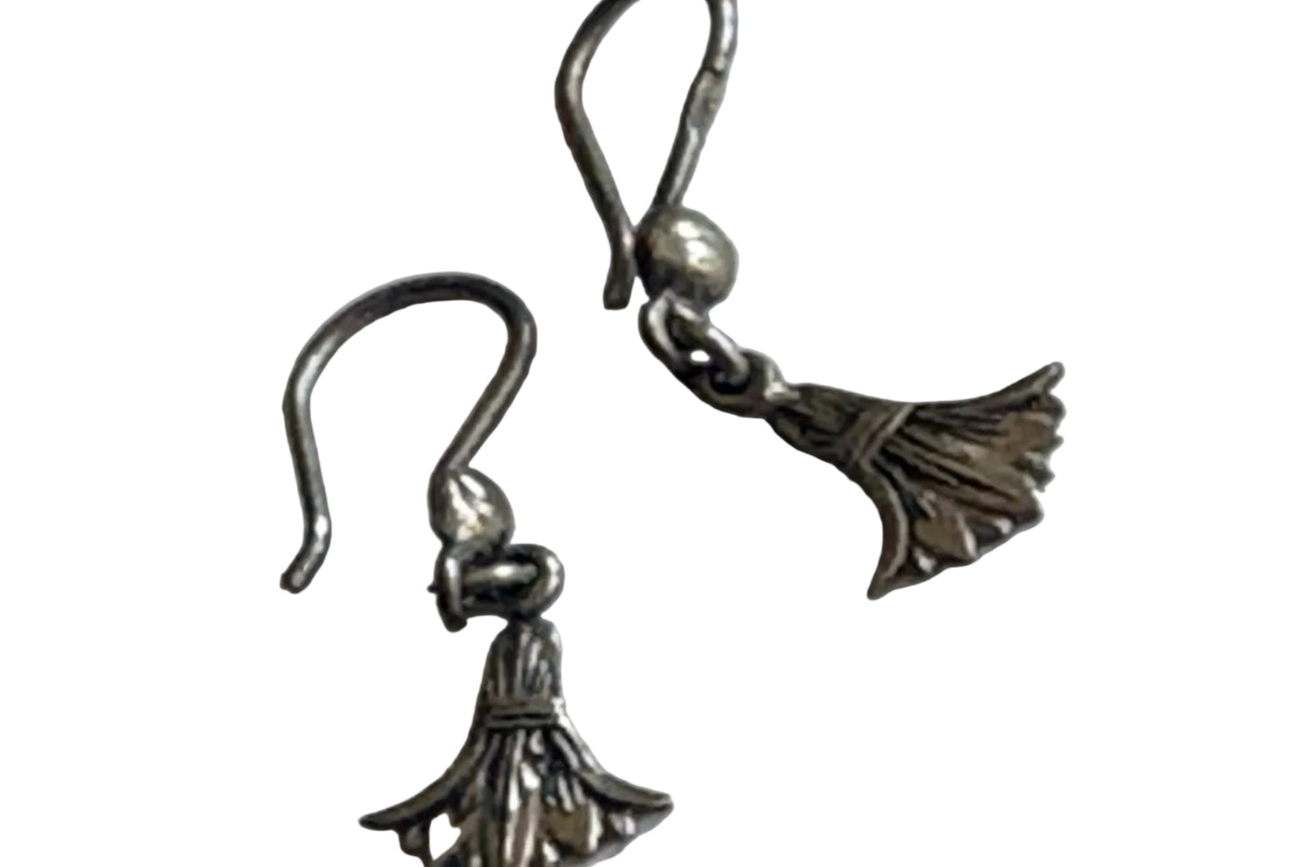 Pair of small silver dangle earrings on a white background