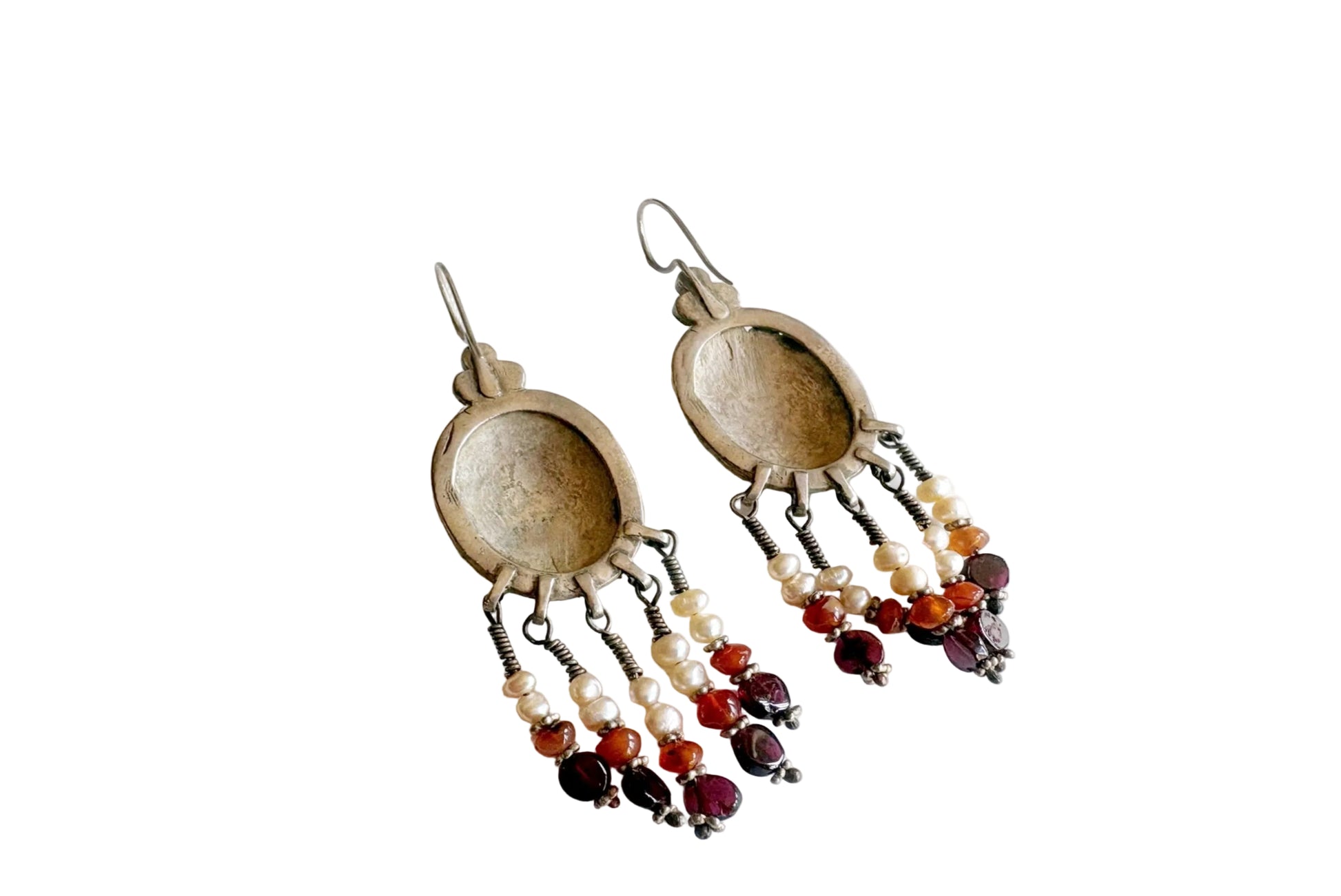 Pair of earrings with beads on a white background