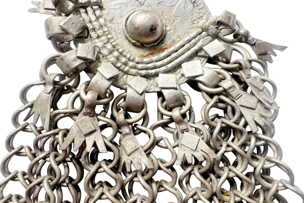 An antique silver-toned metal chainmail pendant with dangling chainmail fringes, shown against a plain white background.