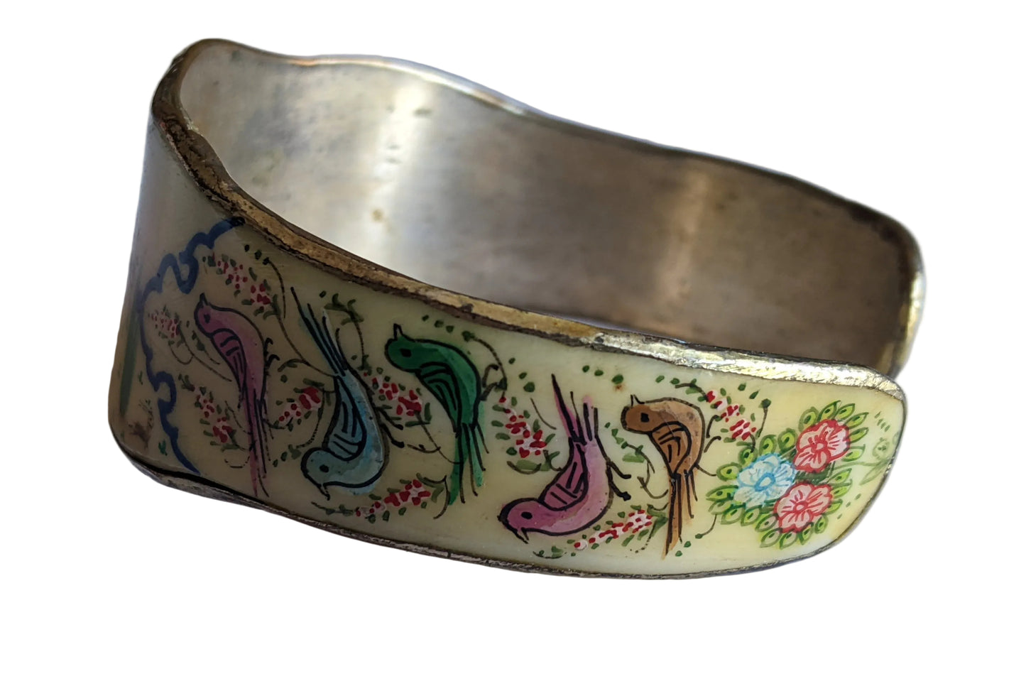 Decorative bracelet with painted birds and flowers on a white background