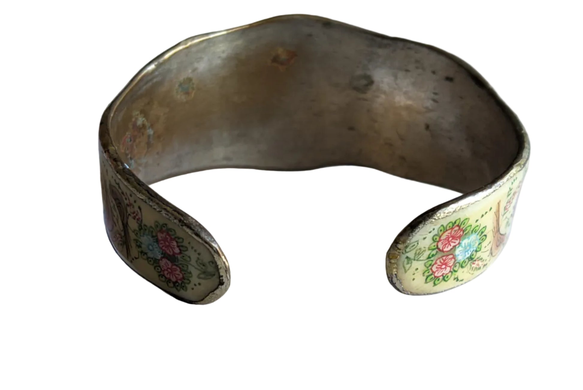 Decorative metal bracelet with floral patterns on a white background