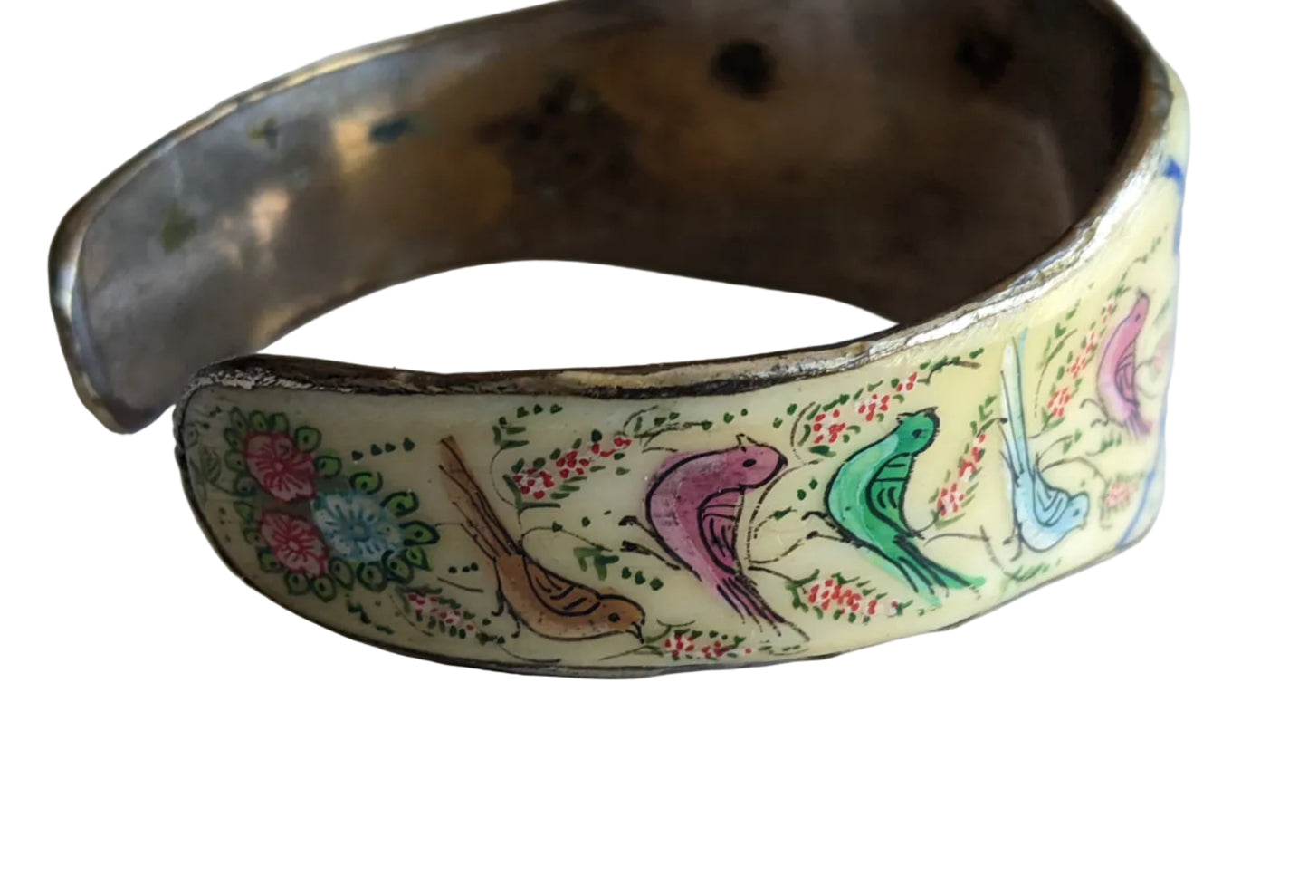 Decorative bracelet with bird and floral patterns on a white background