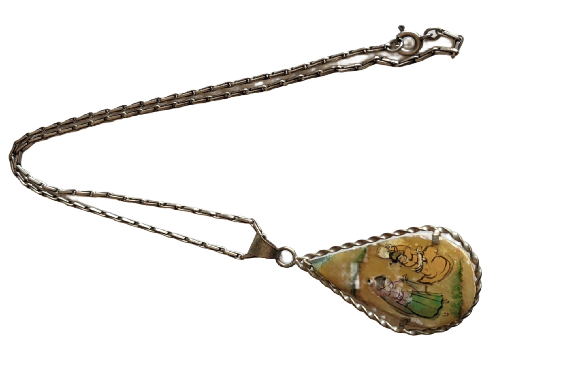 hand painted mother of pearl pendant on a chain on a white background