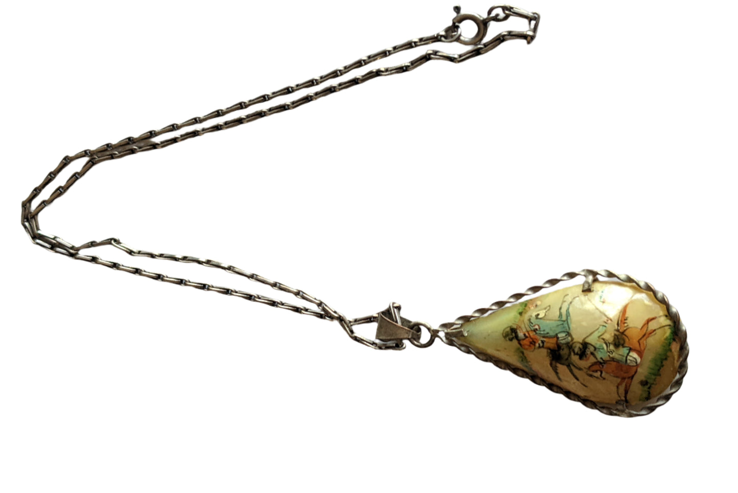 Teardrop-shaped pendant with a chain on a white background