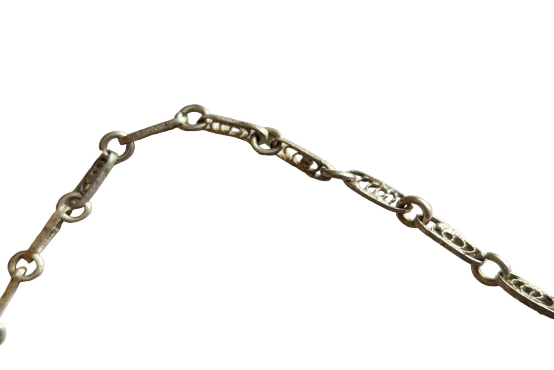 silver chain made of filigree elements on a white background