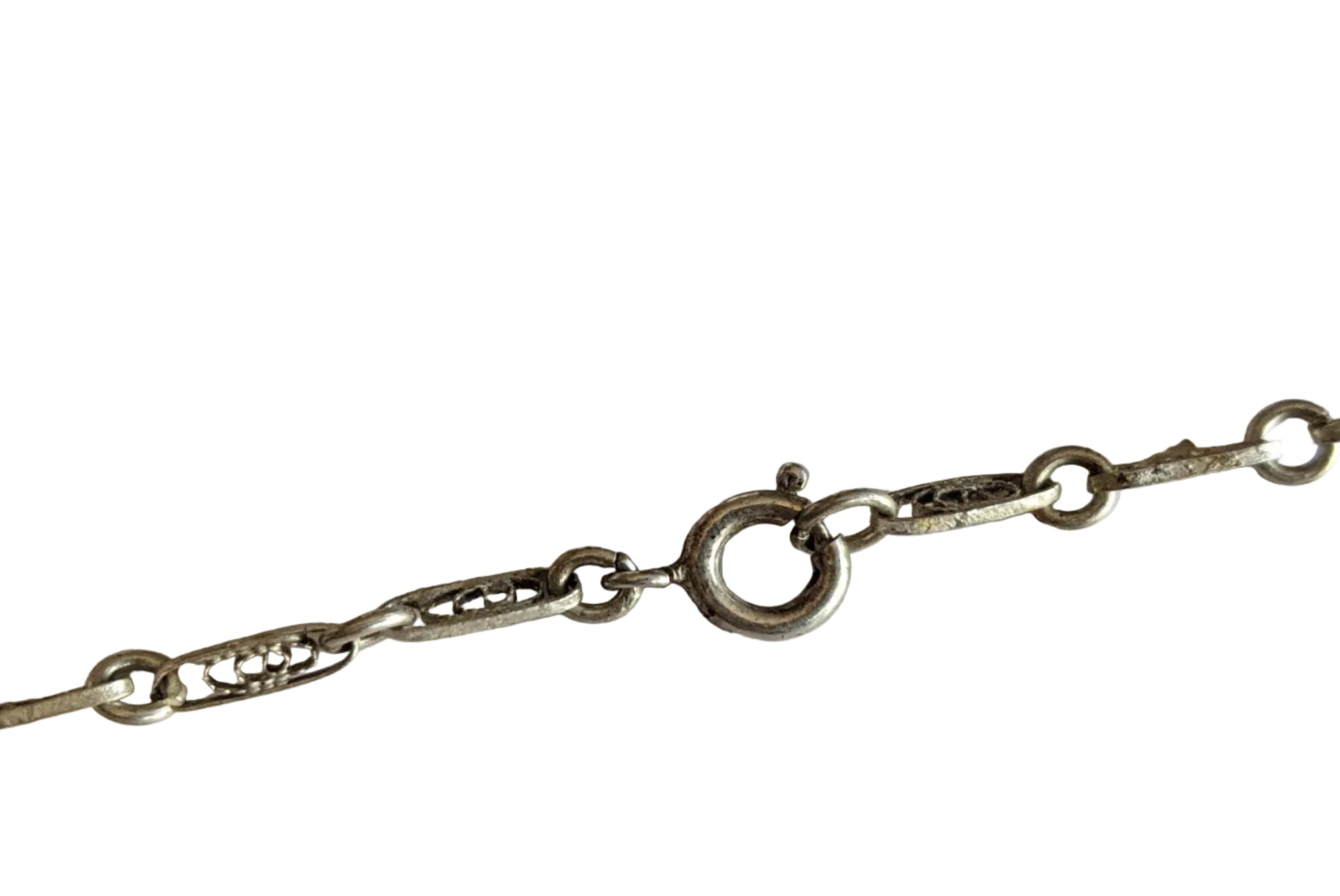 Silver filigree chain  with spring closure on a white background