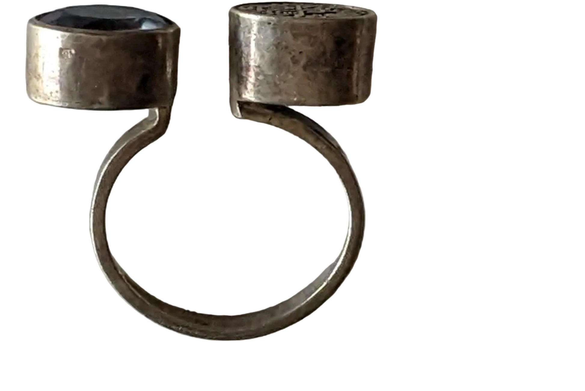 Silver ring with double cabochons on a white background