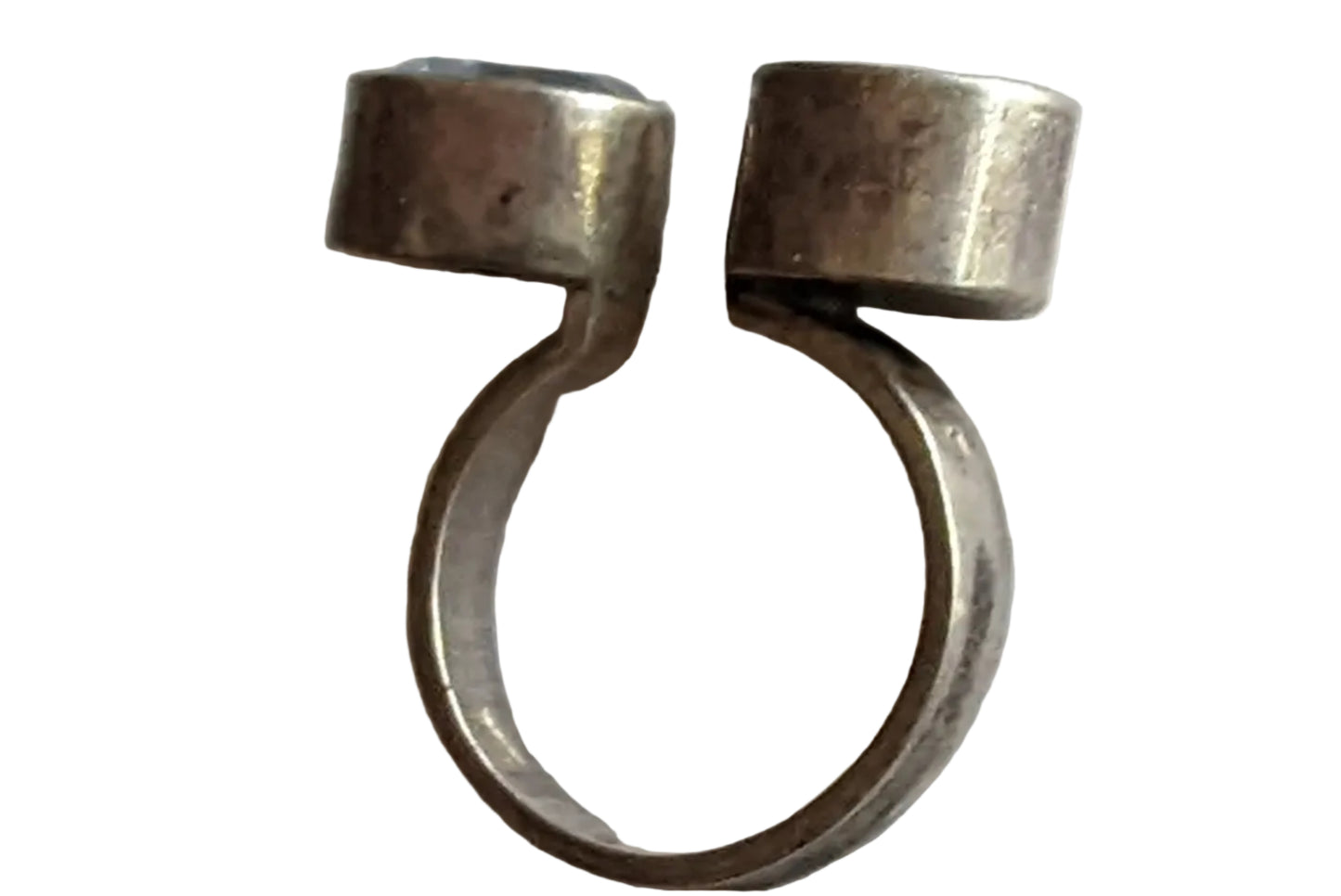 Silver  ring with cylindrical ends on a white  background