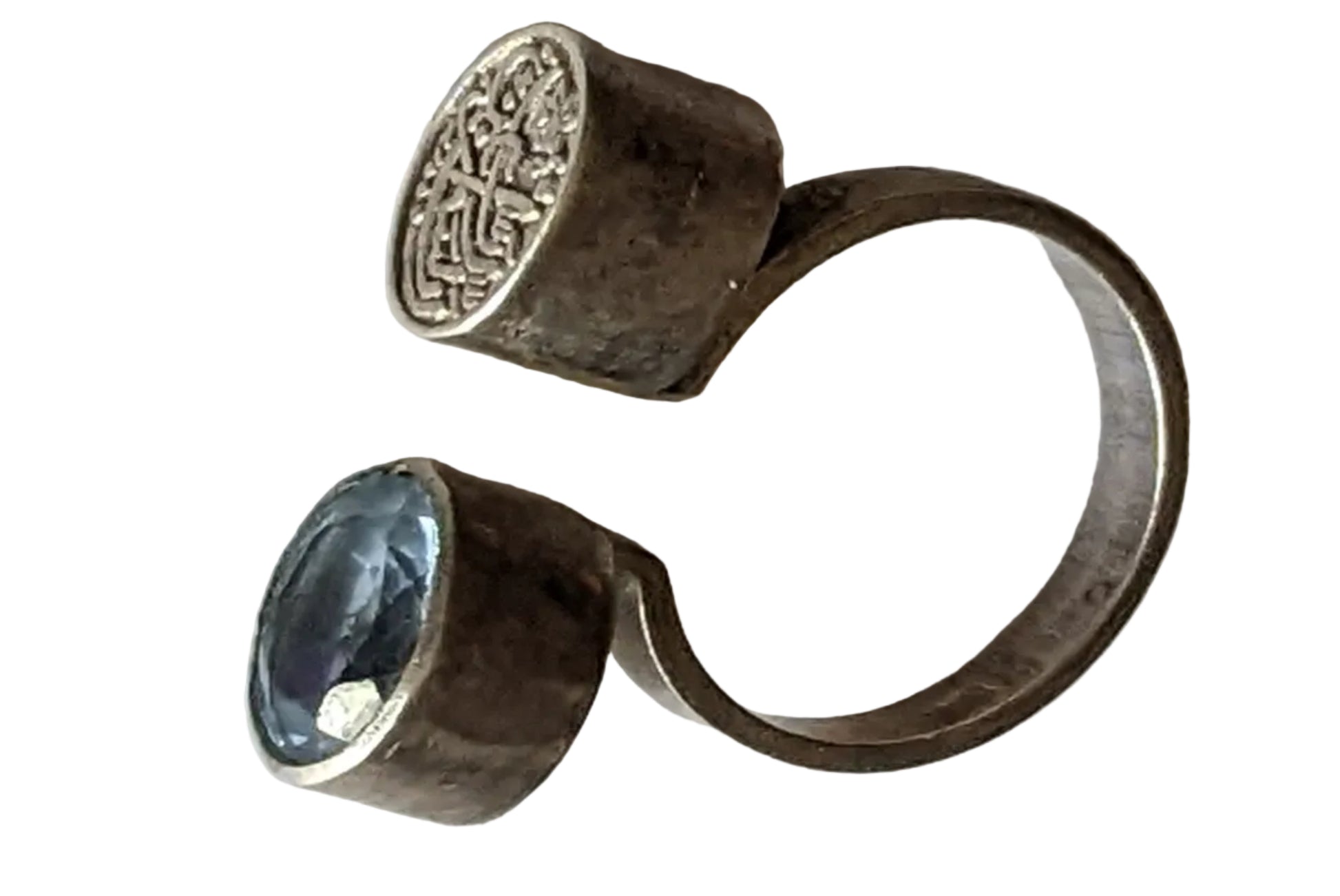 Silver ring with a blue gemstone on a white background