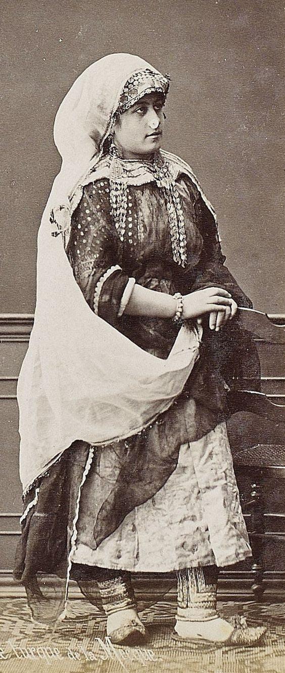 Arab woman wearing long temporal adornments