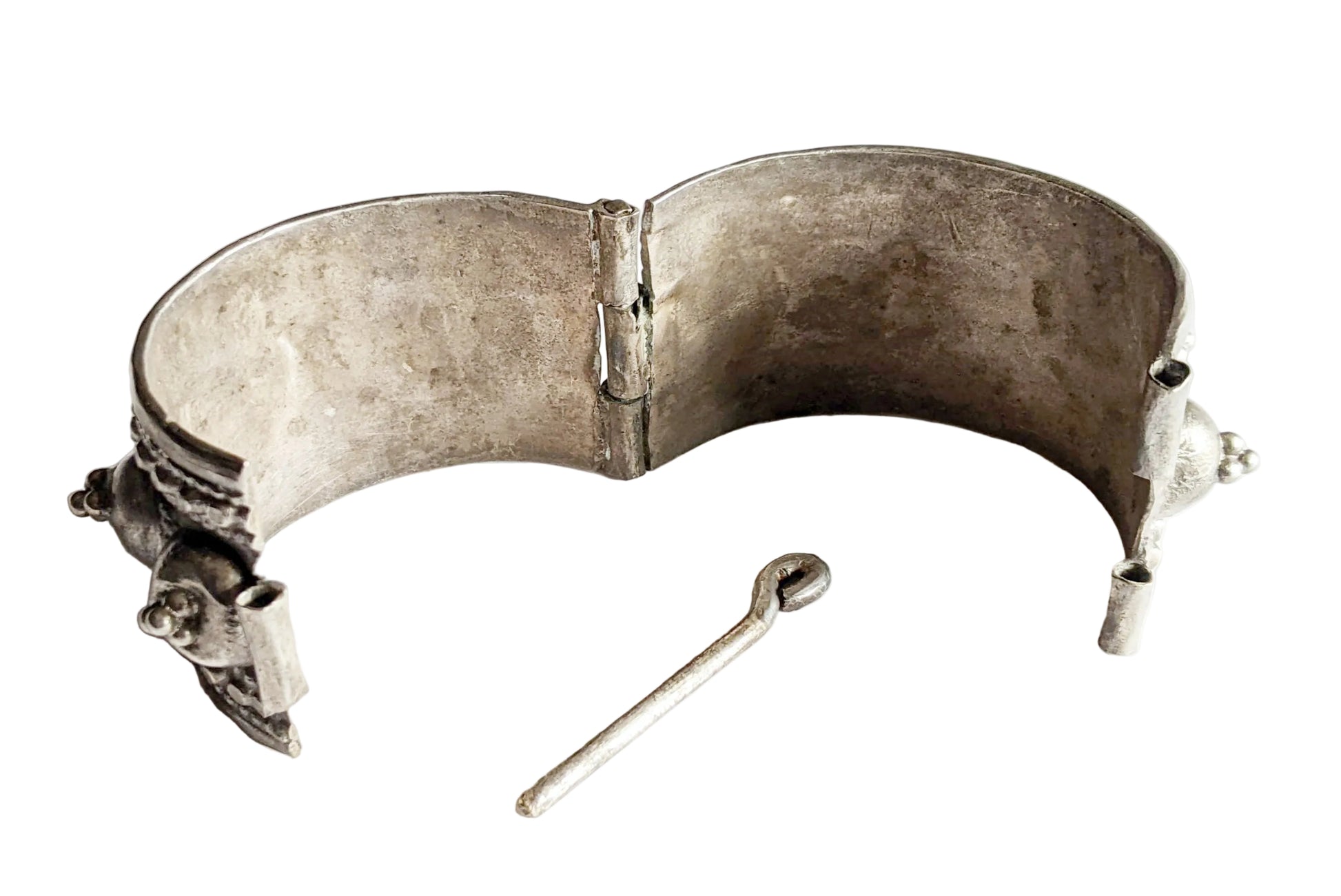 Silver bracelet with a clasp on a white background