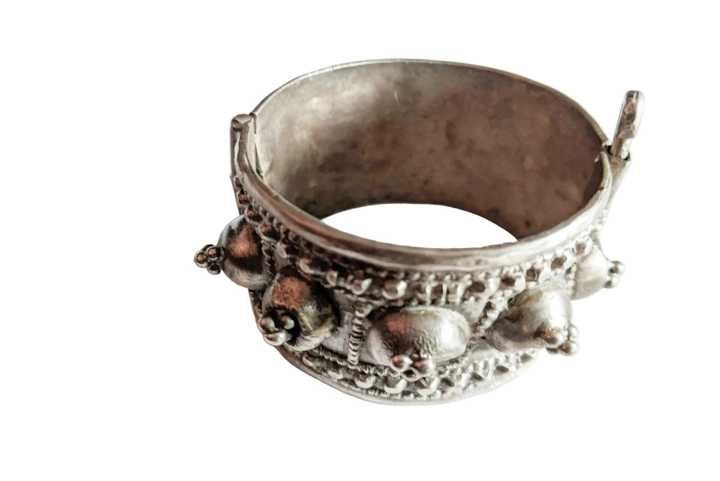 Decorative silver bracelet on a white background