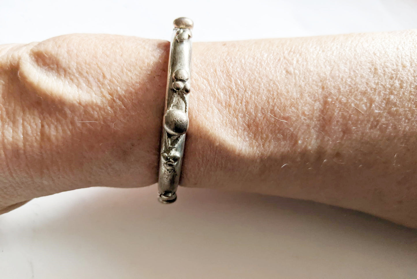 Single Tier Silver Currency Nubian Bracelet