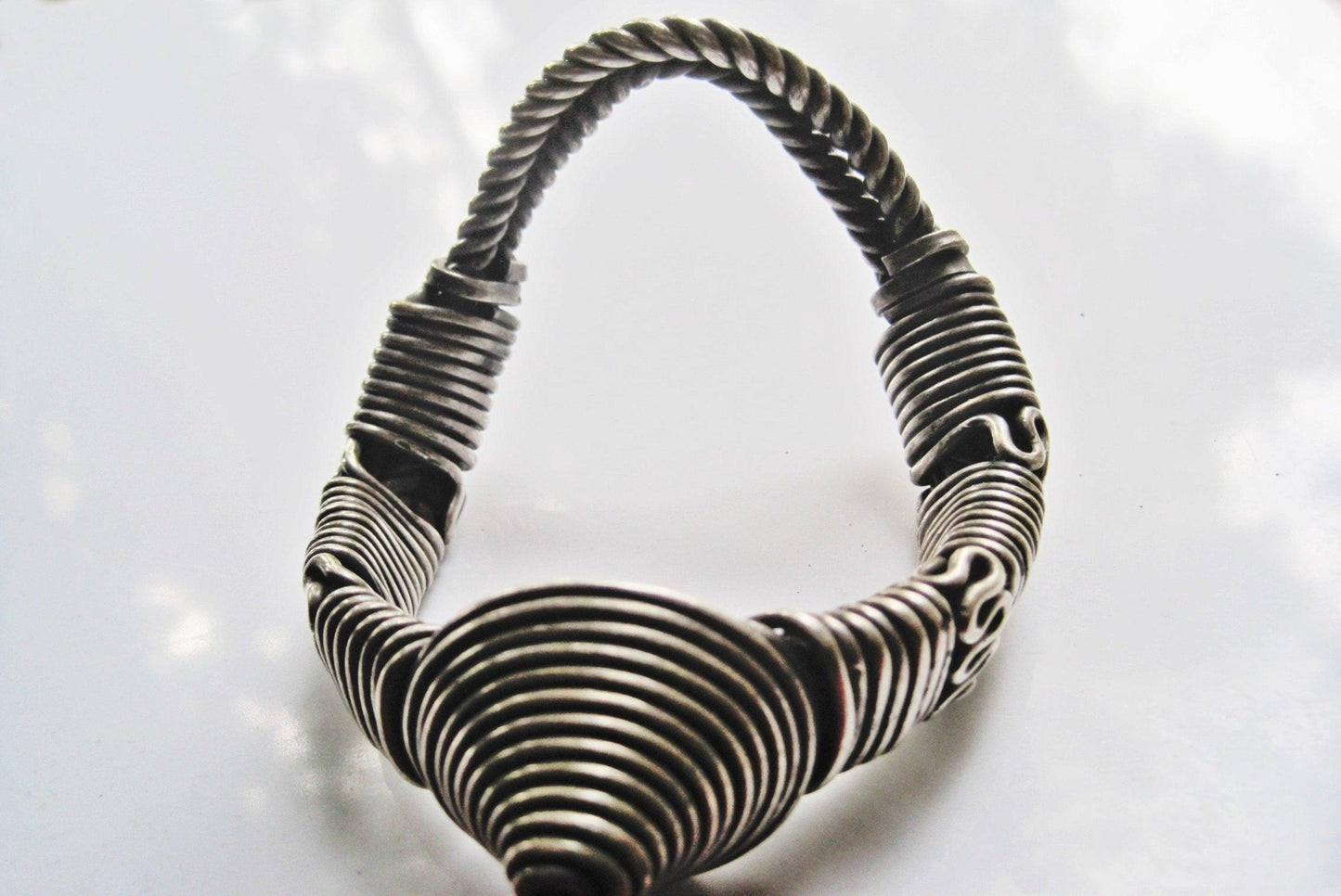 Wire silver armlet from India