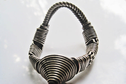 Wire silver armlet from India