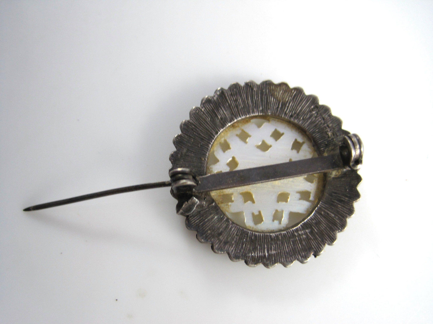 carved mother of pearl brooch