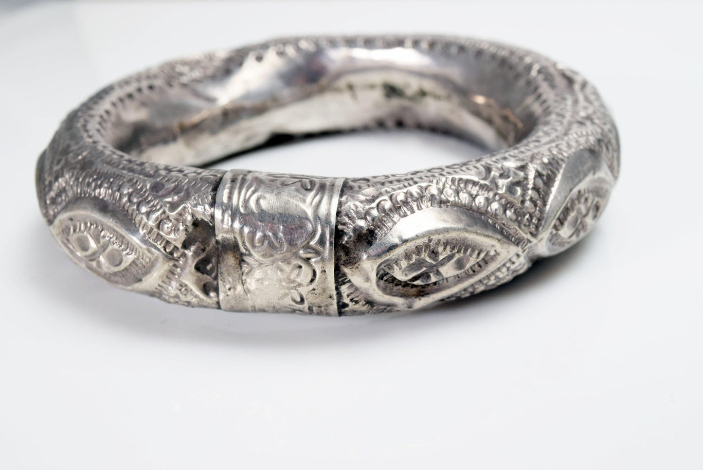 silver bangle with eye motif